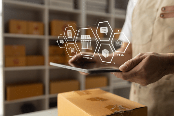 A man who works in foreign trade operations holds up a tablet that shows him the infinite possibilities for Supply Chain management so that he can outperform his competitors.